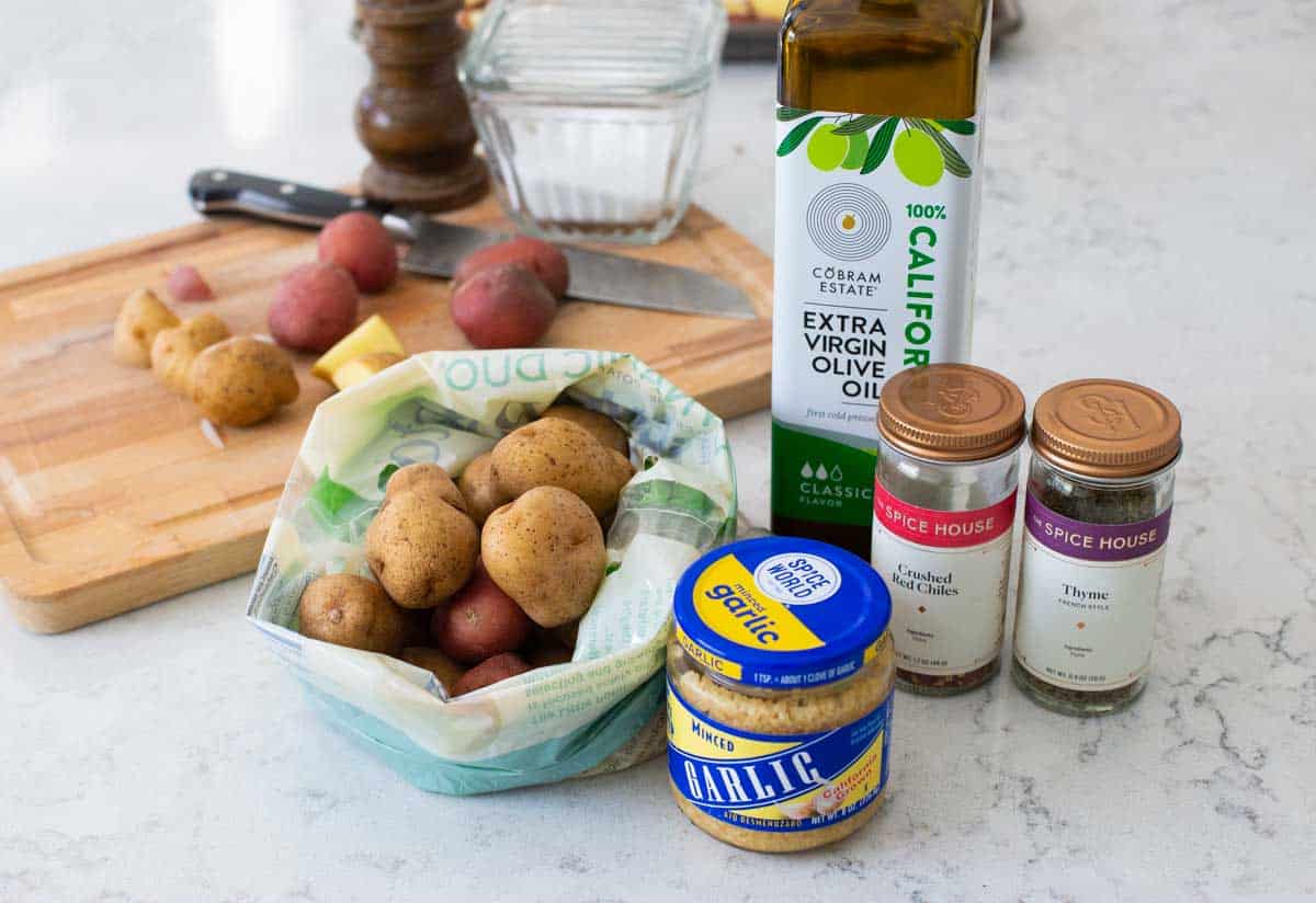 The ingredients to make roasted potatoes on the counter.