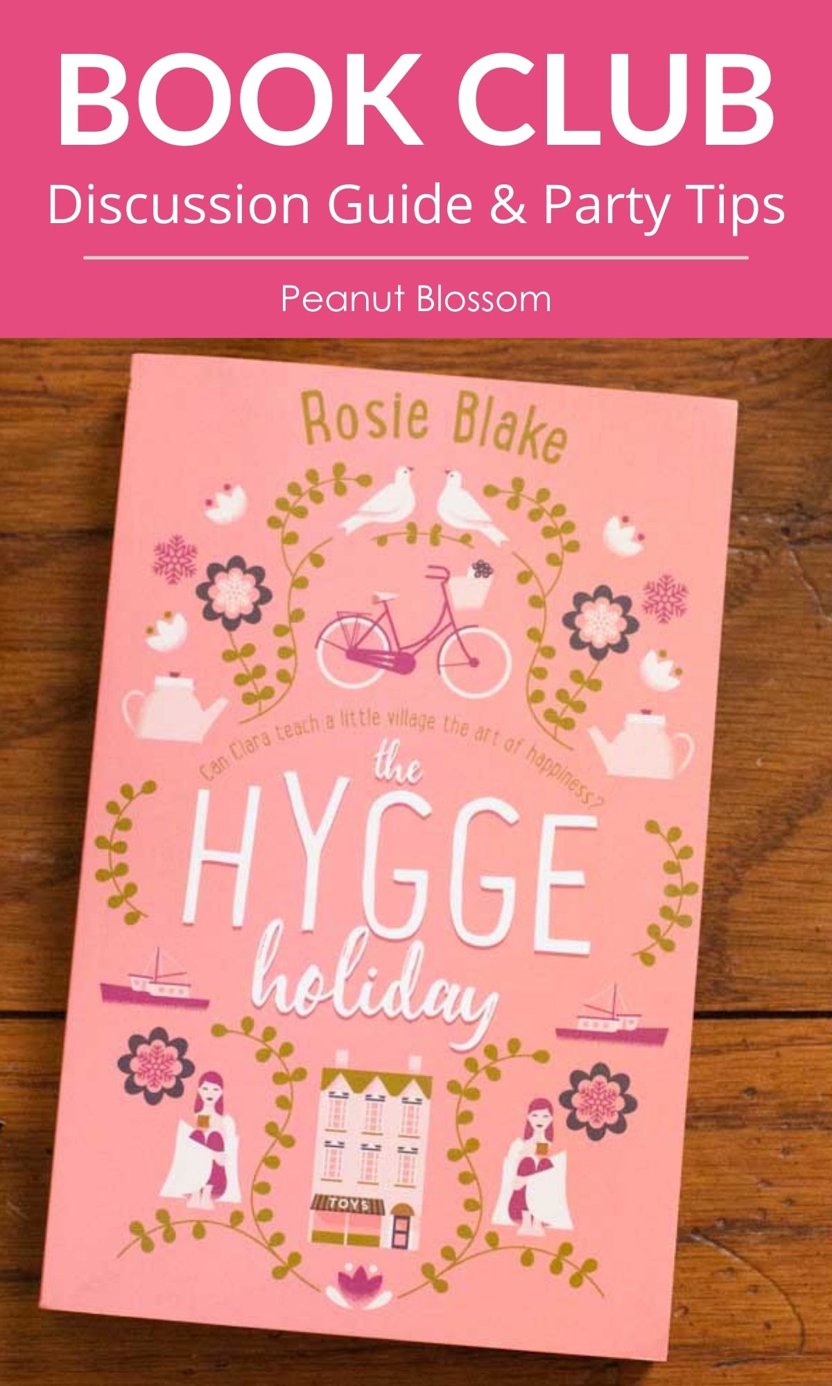A copy of The Hygge Holiday sits on a table.