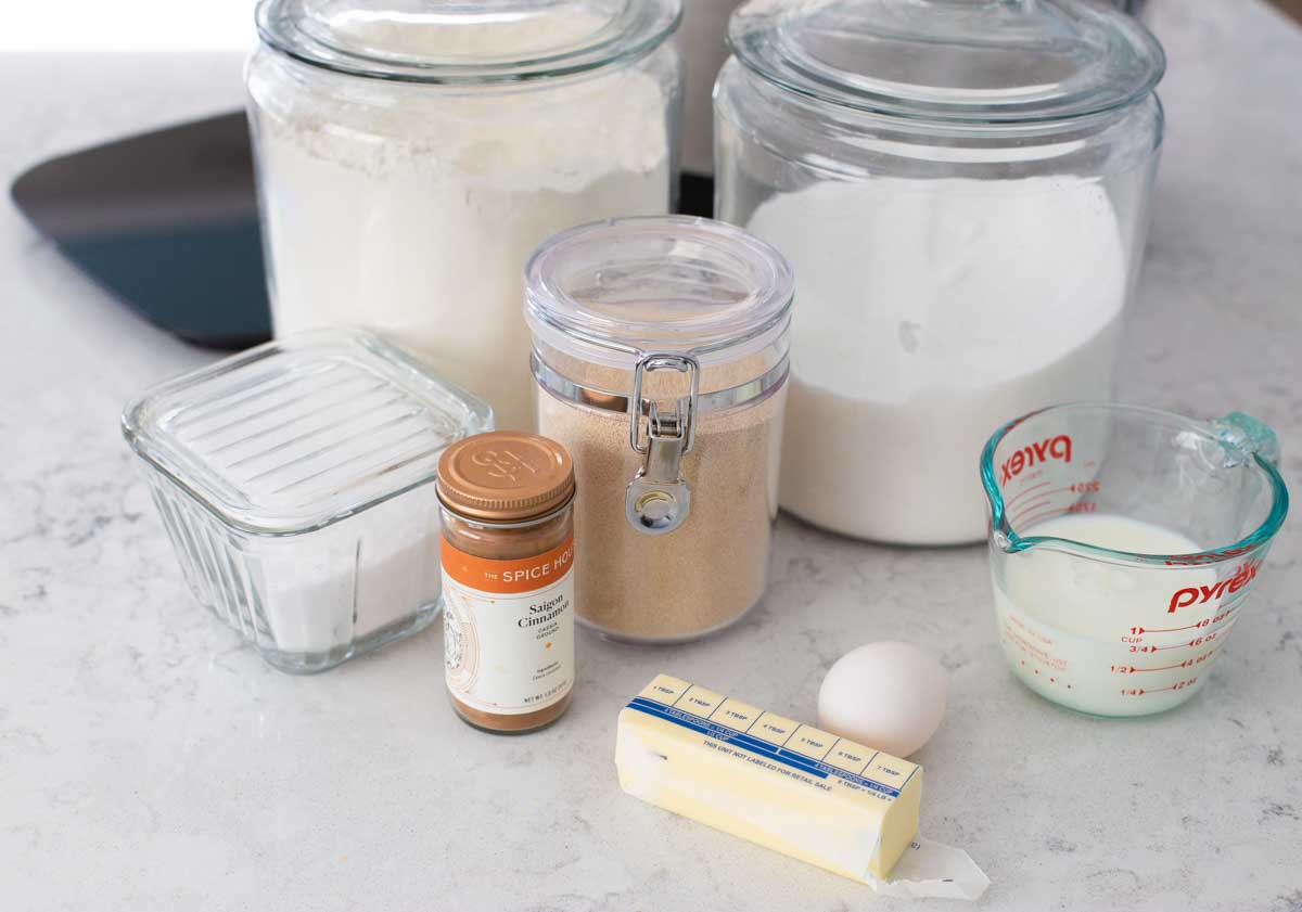 The ingredients to make cinnamon pull apart bread are on the counter.
