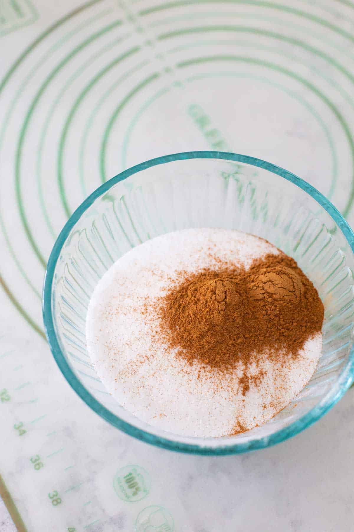 The cinnamon and sugar are in a mixing bowl.