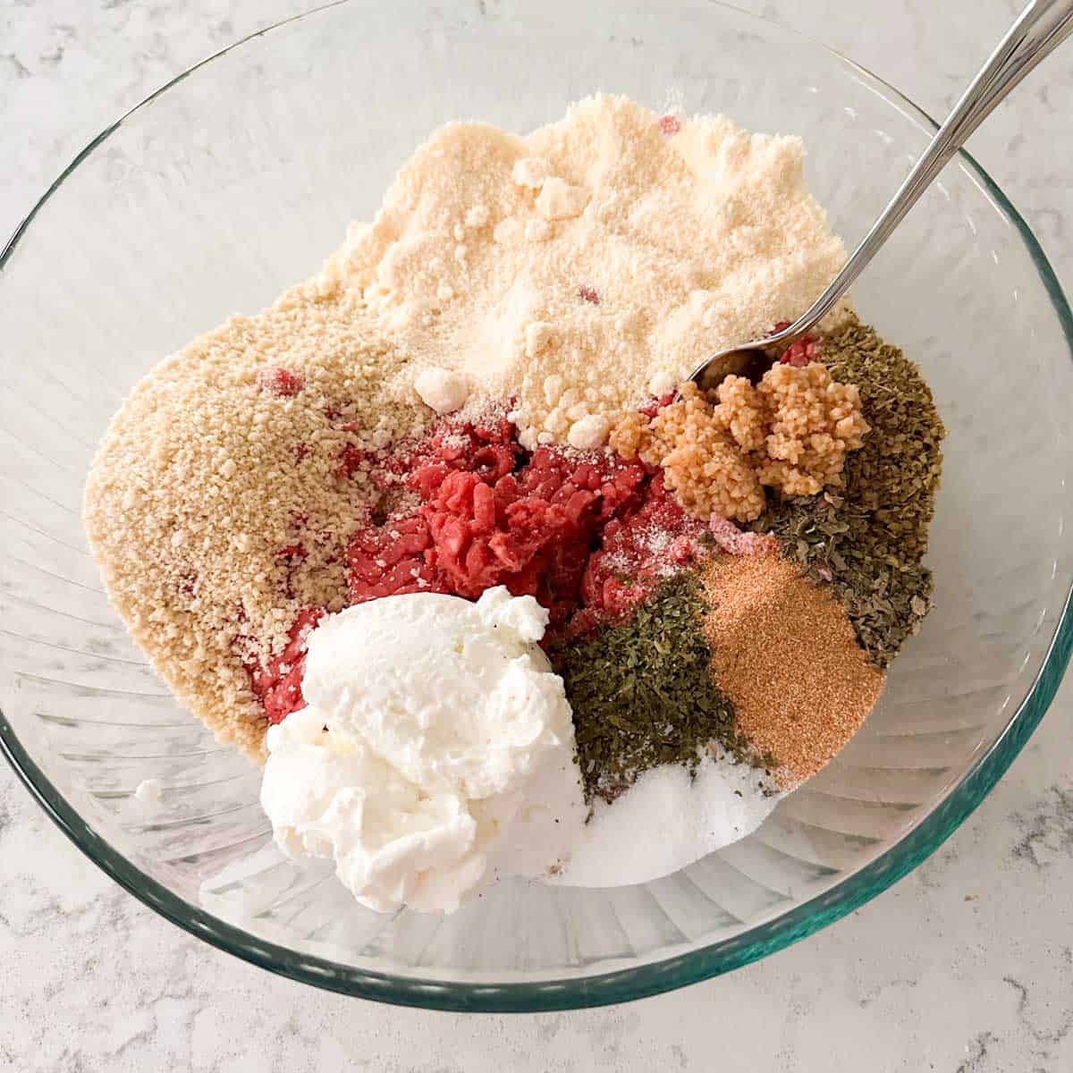 The ingredients have been added to a large mixing bowl.