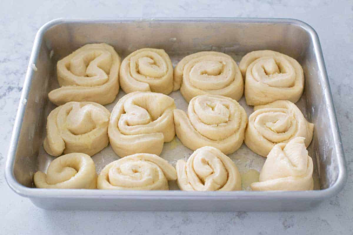 The orange rolls have risen again and are ready for baking.