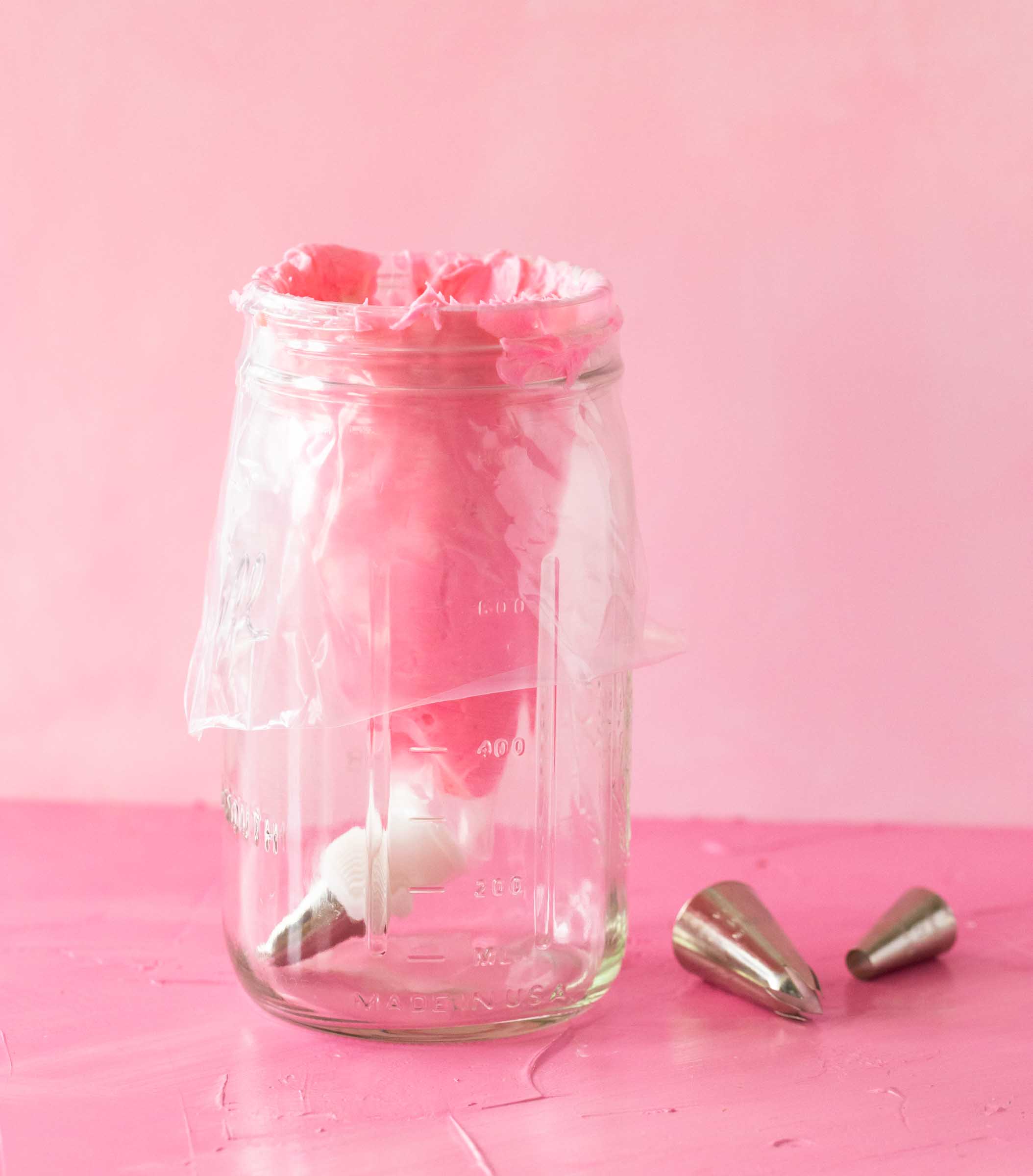 A piping bag in a jar with tips.