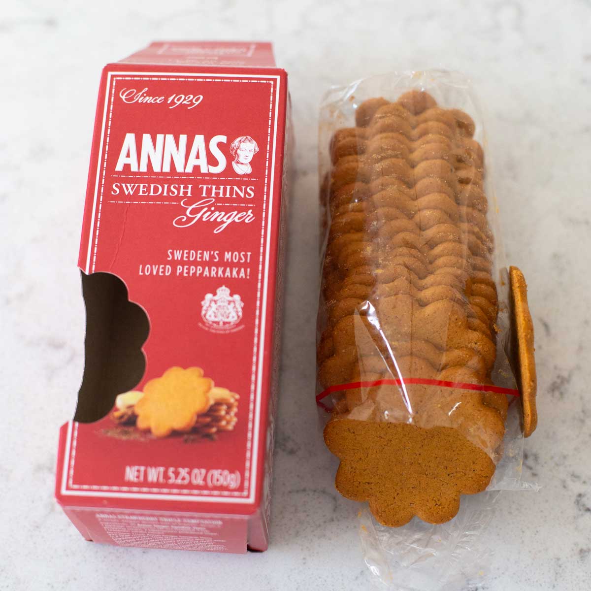 A package of ginger thin cookies is opened to show the texture of the cookie.