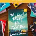 A copy of The Last Thing He told Me sits on a table.