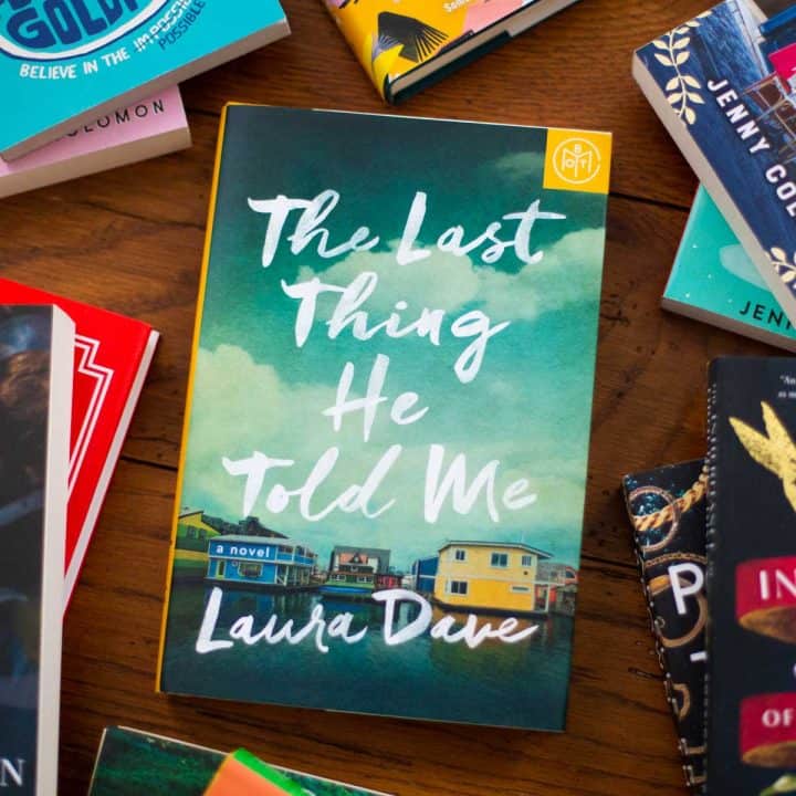 A copy of The Last Thing He told Me sits on a table.