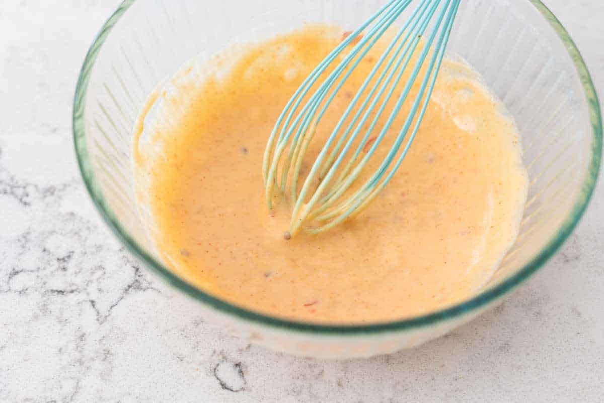 The bang bang sauce is all done and sitting in the mixing bowl with a whisk.