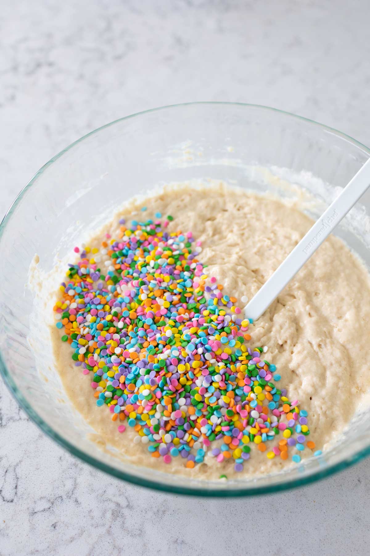 The waffle batter has been covered in sprinkles.