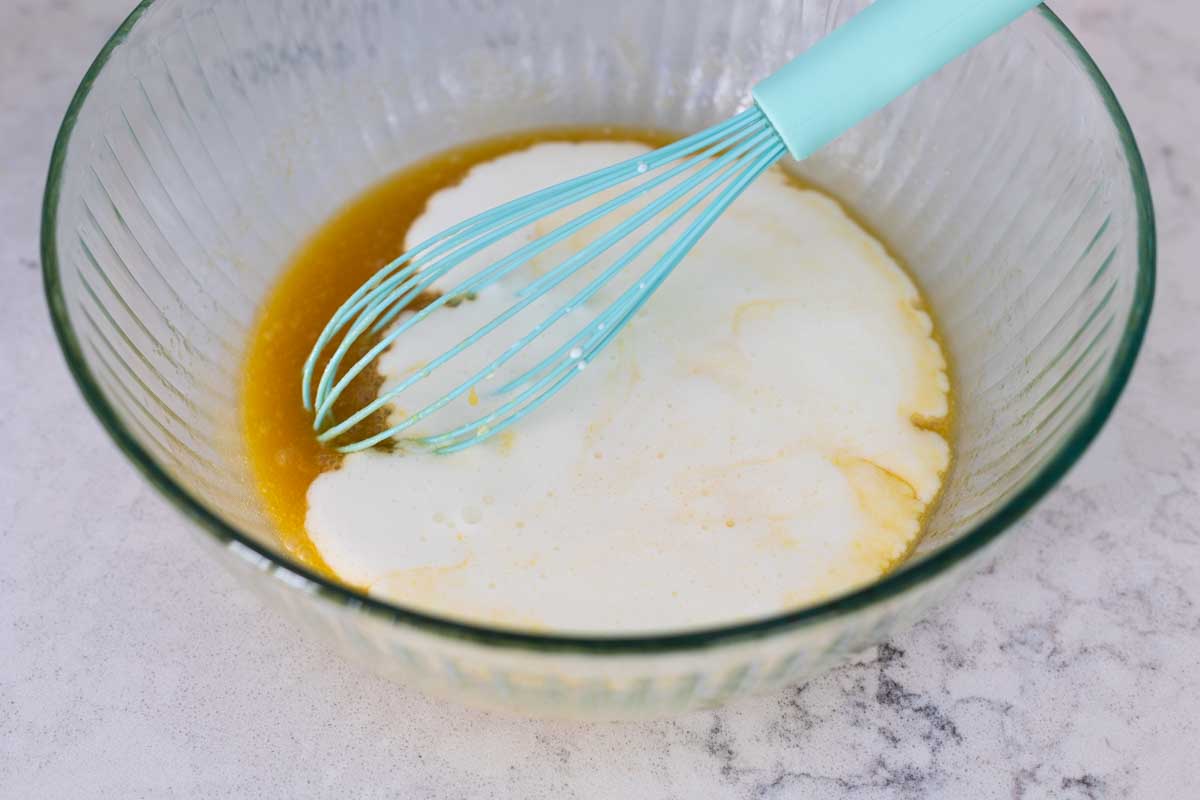 The buttermilk is added to the butter.