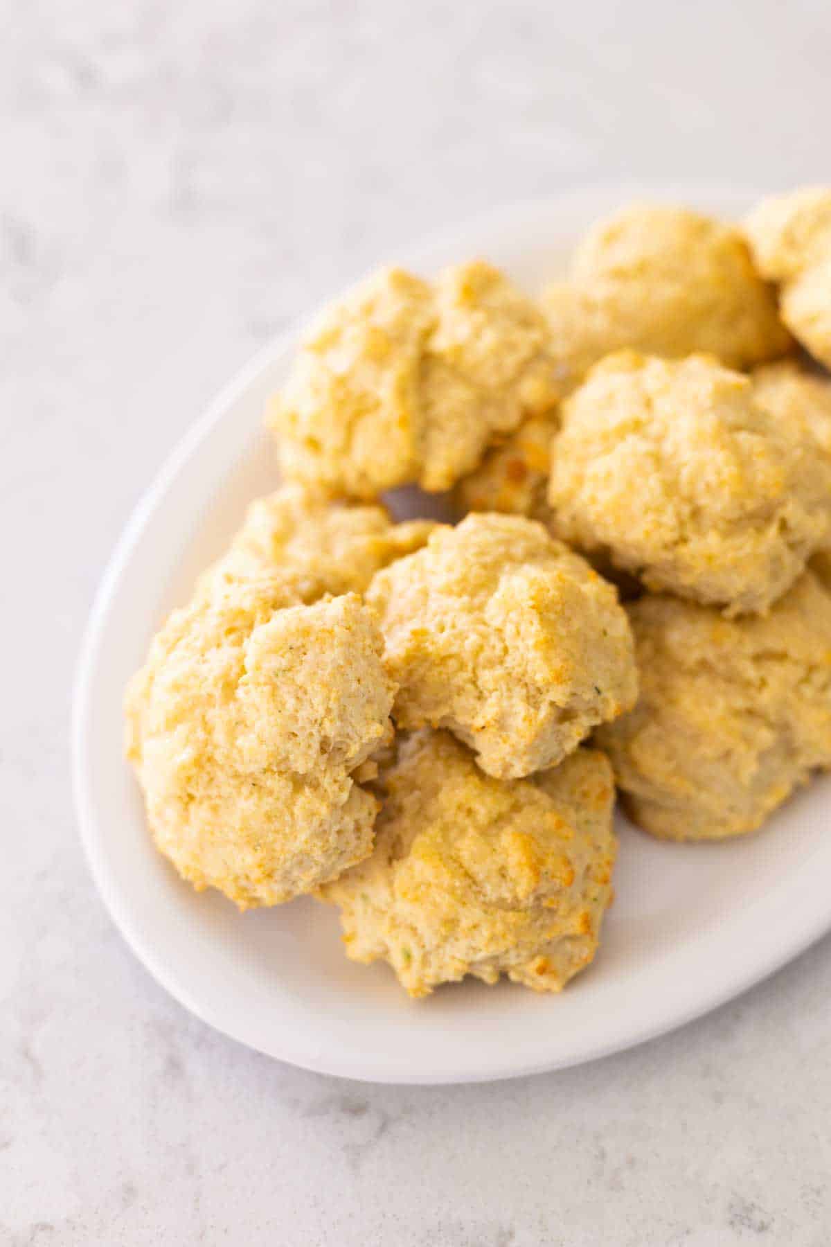 A platter of baked buttermilk biscuits.