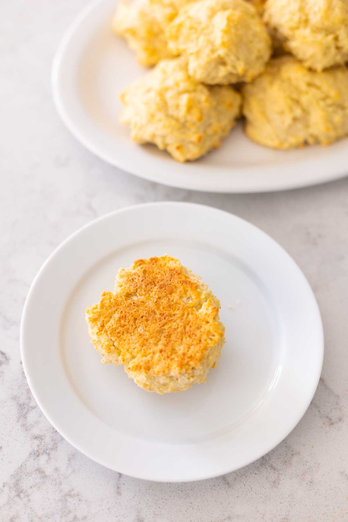 A biscuit has been turned over to show the golden brown color.