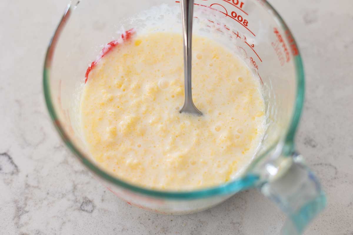The butter and buttermilk have been stirred together and appear curdled in texture.
