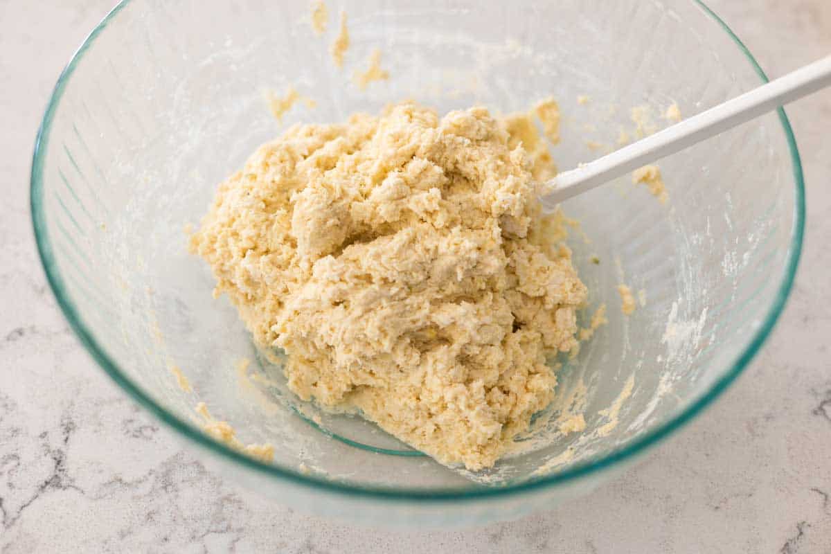 The dough has been formed in the mixing bowl and appears just a little shaggy.