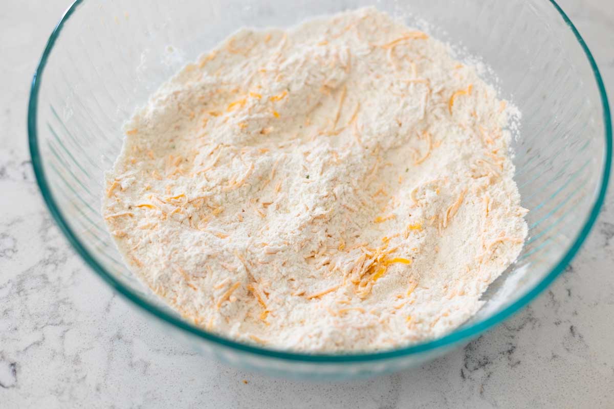 Stir the cheese into the dry ingredients so it doesn't clump together.