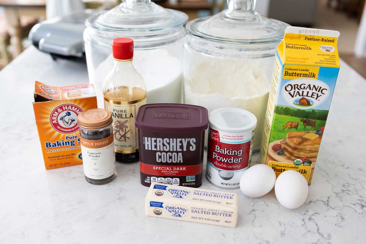 The ingredients to make homemade chocolate waffles are on the counter.
