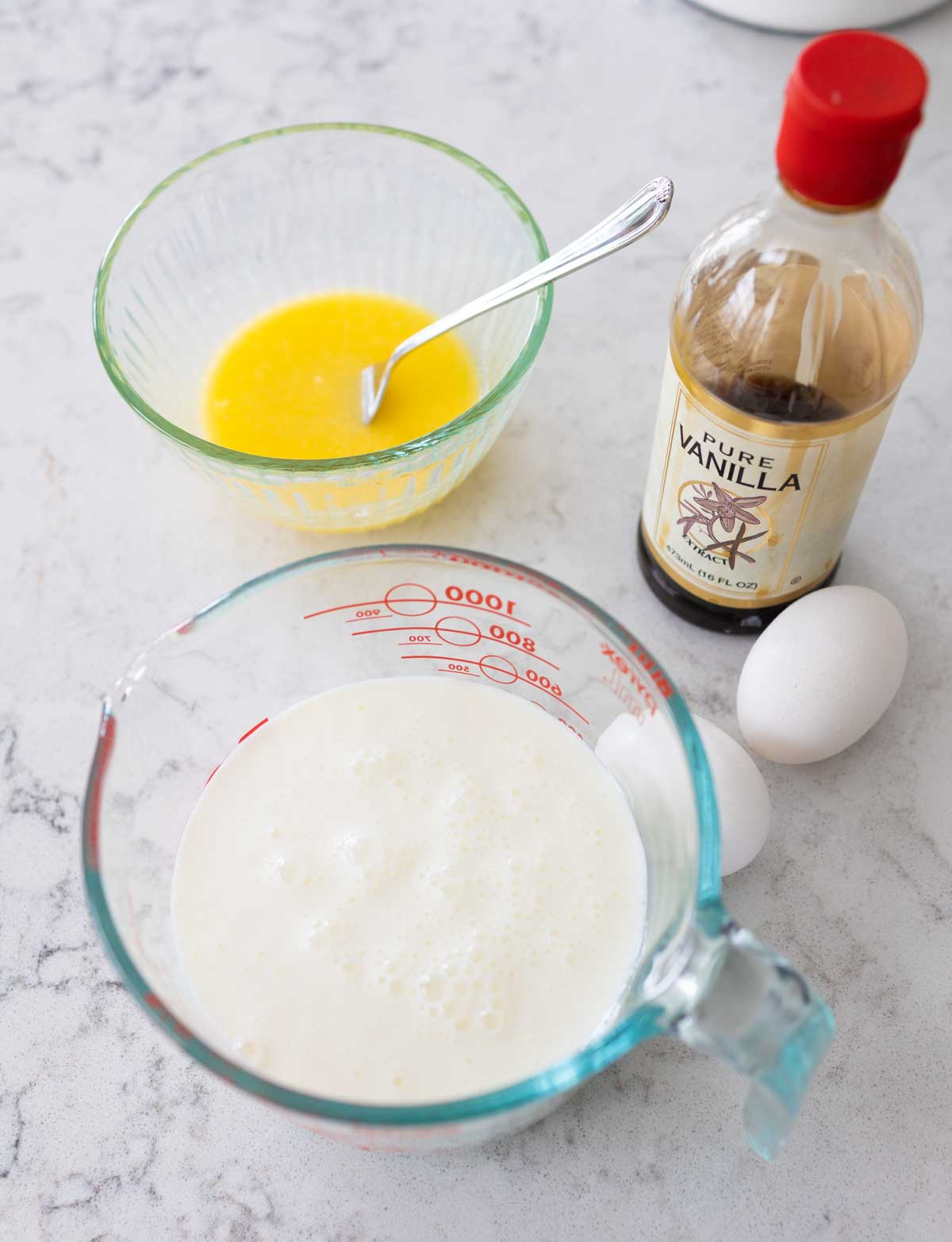 The buttermilk, eggs, melted butter, and vanilla are about to be mixed in a bowl.