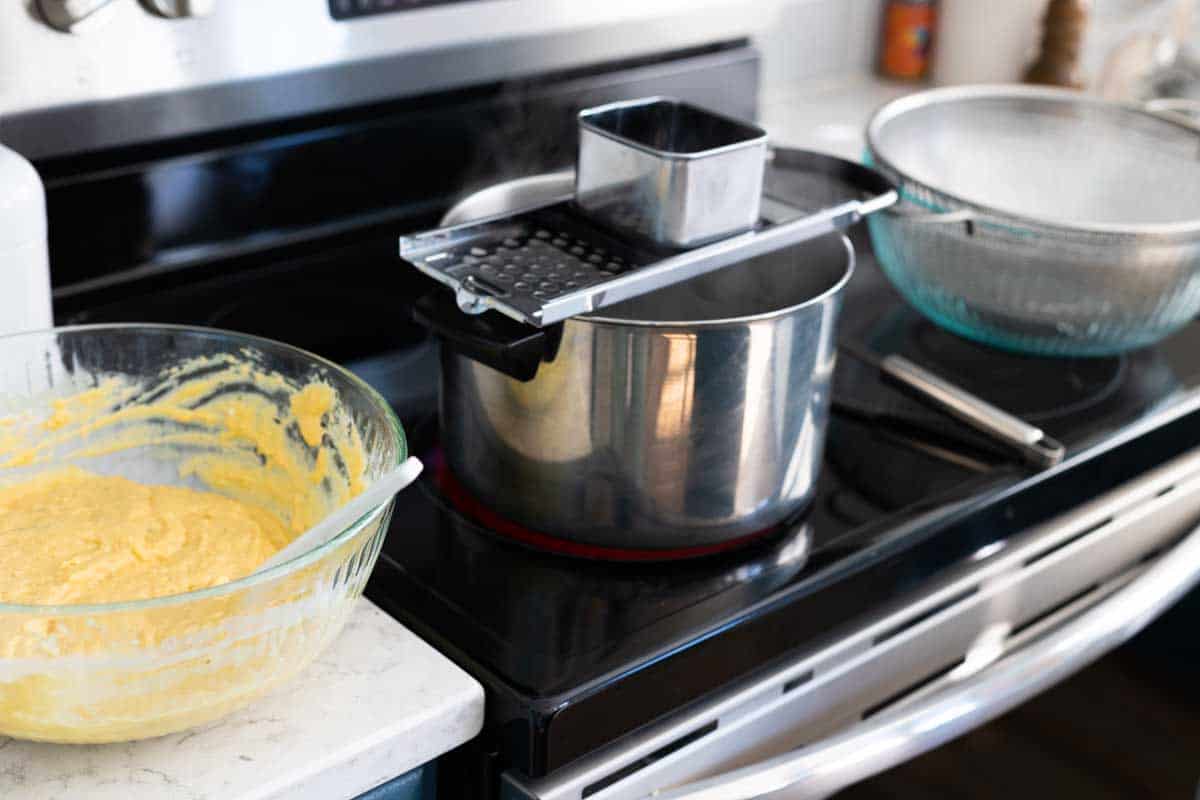 The pots on the oven show how to set up the assembly line for the spaetzle.