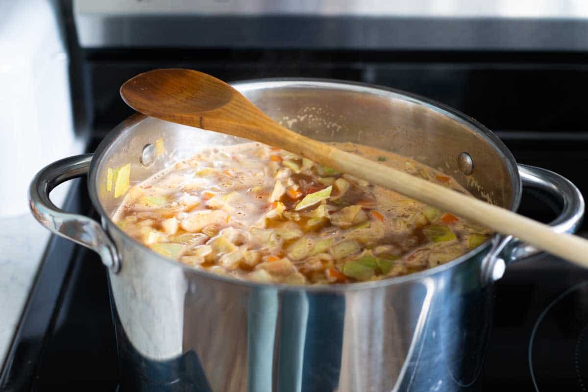 A wooden spoon over the top of the pot helps prevent it from boiling over.