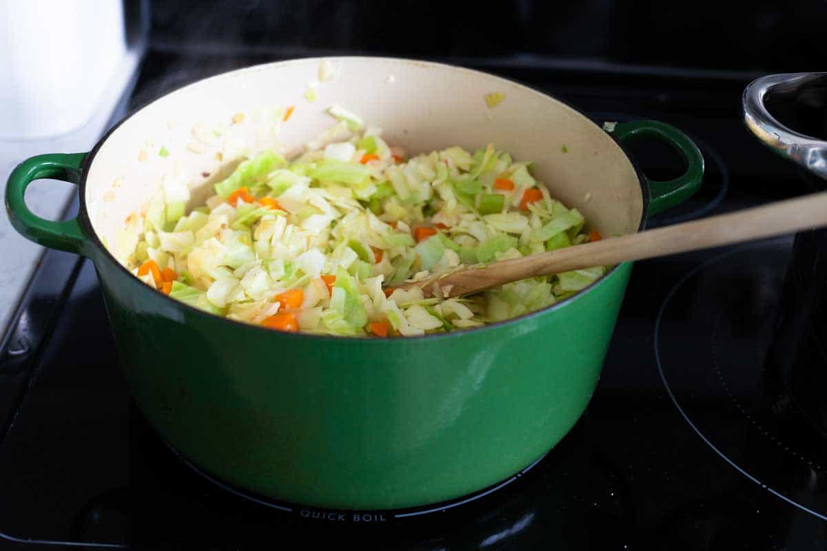 The cabbage has wilted down and the pot now shows several inches of space.