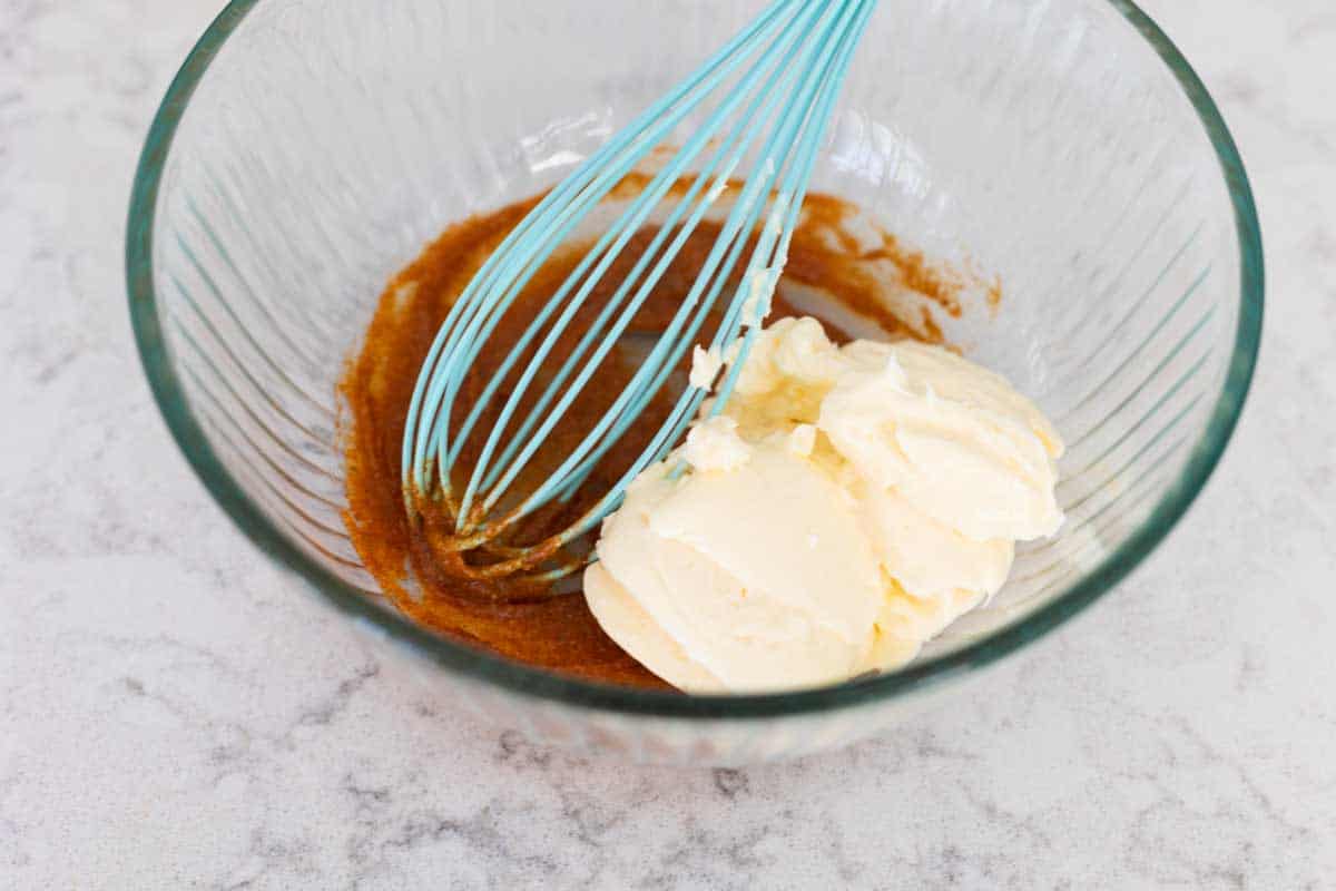 The seasonings were whisked into the butter and now mayo is added to the bowl by the whisk.