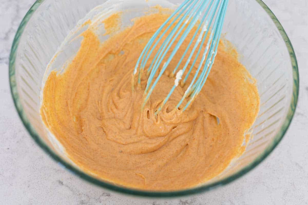 The thick sauce has not had water added yet. Shows texture.