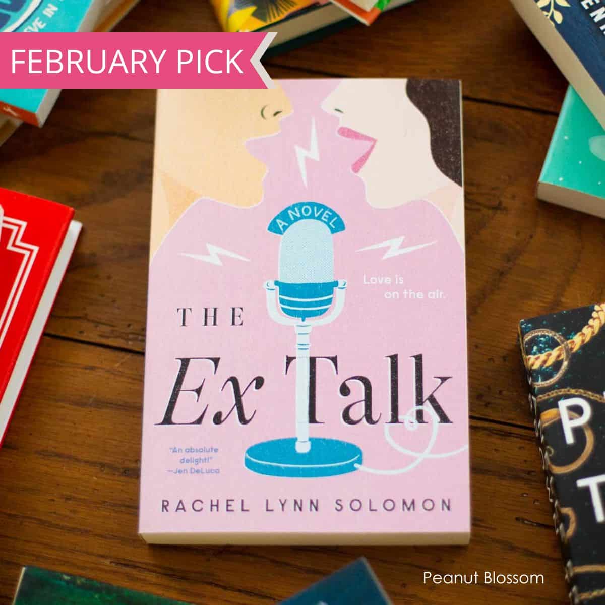 A copy of The Ex Talk is on the table.