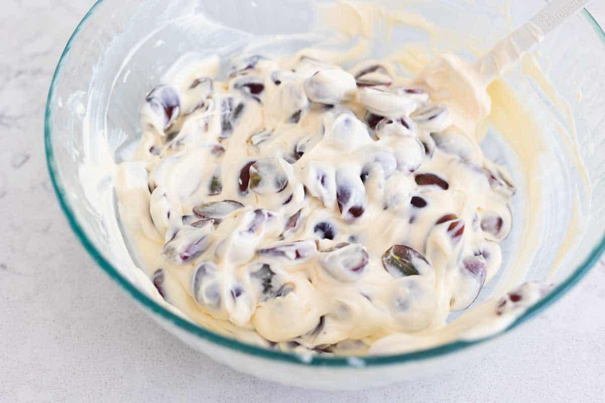 The grapes have been stirred into the cream cheese dressing.