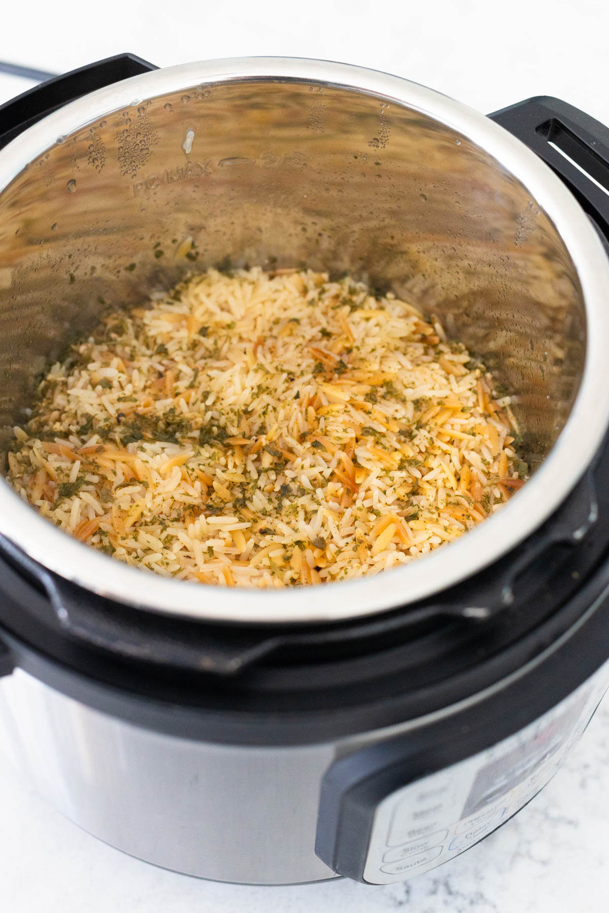 The rice pilaf has finished cooking in the Instant Pot and has more than doubled in size.
