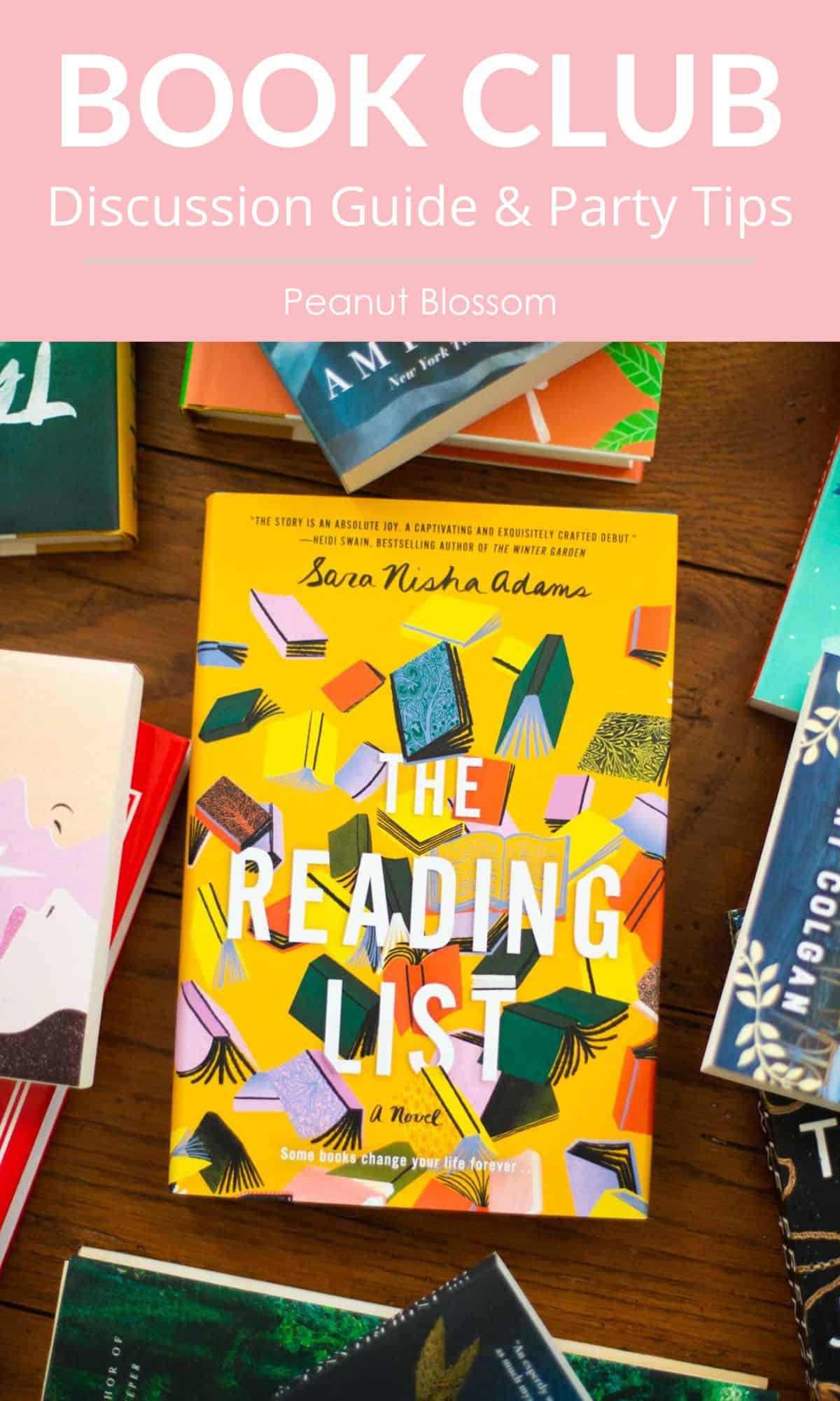 A copy of The Reading List sits on a table surrounded by other books.
