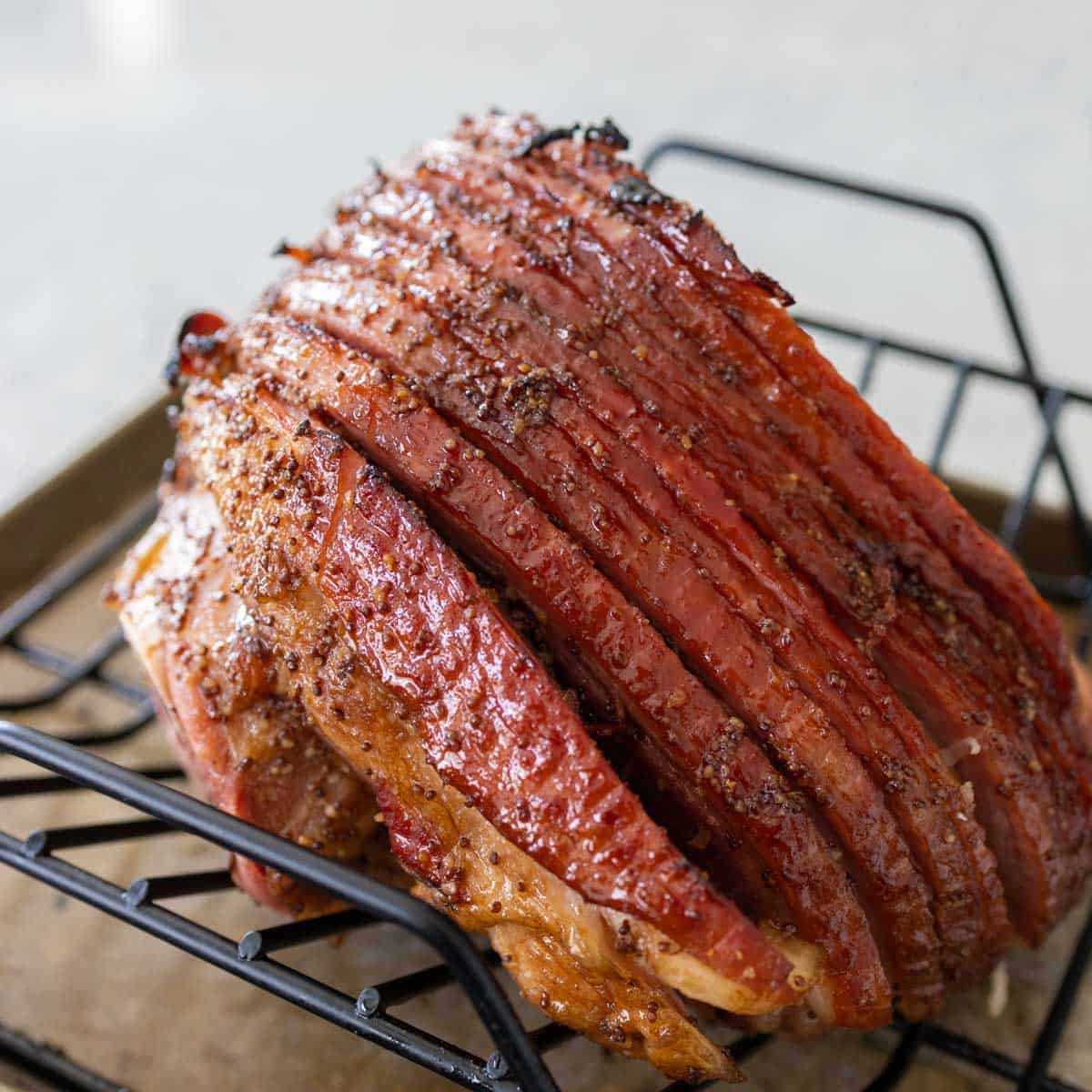 The ham is about to be cut into slices for serving.