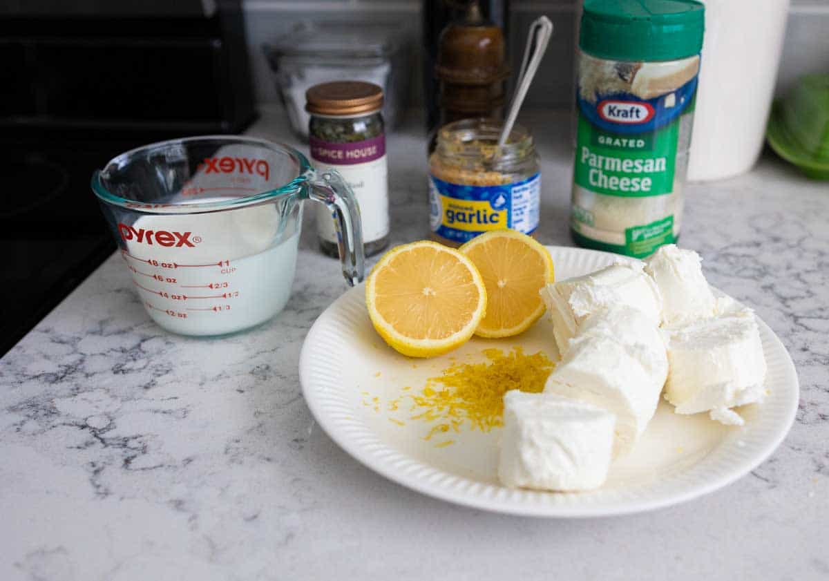 The ingredients to make the sauce are gathered near the stovetop.