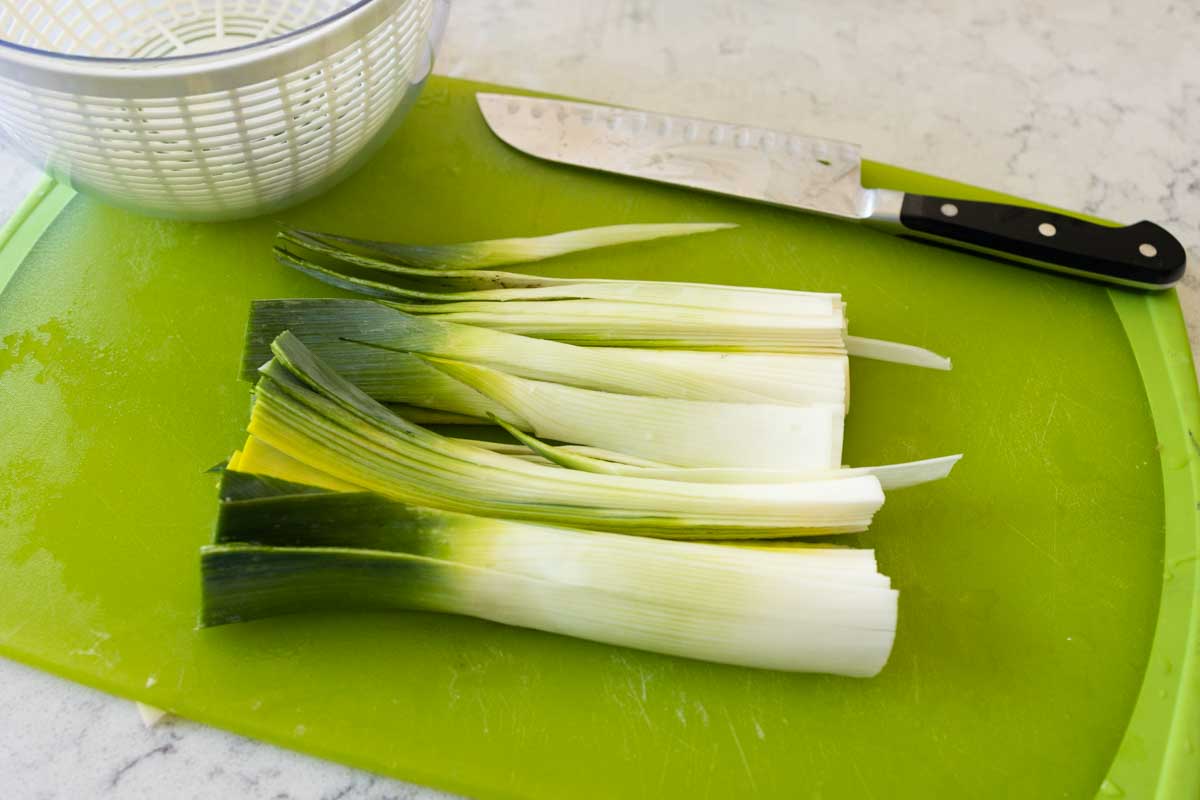 The leek halves have now been sliced into strips.