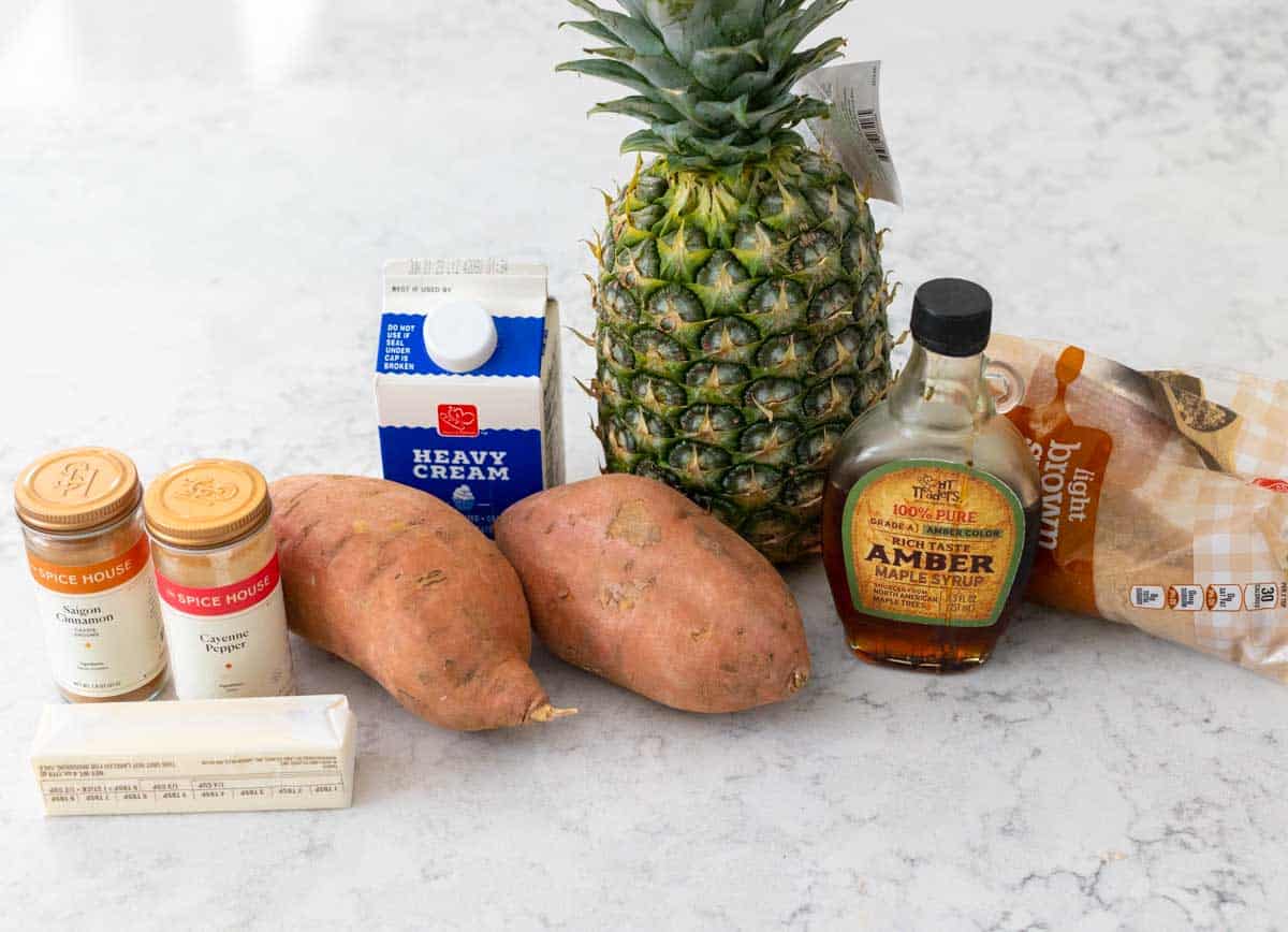 The ingredients to make the creamy mashed sweet potatoes and pineapple are on the counter.