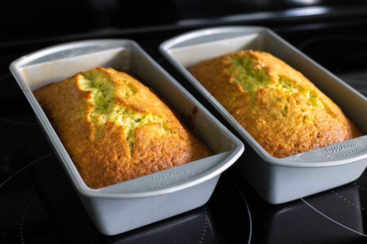 The two loaves are cooling on the stovetop.