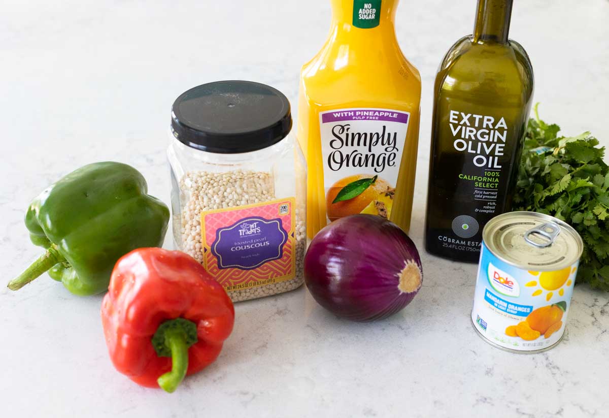 The ingredients to make warm couscous salad are on the counter.