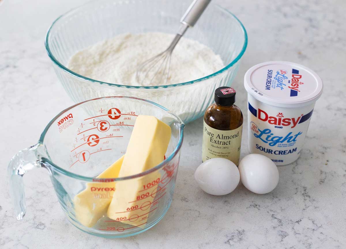 The ingredients to make the cake are on the counter.