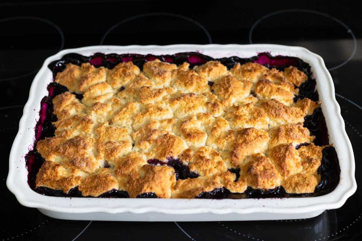 The finished cobbler is cooling on the stovetop.