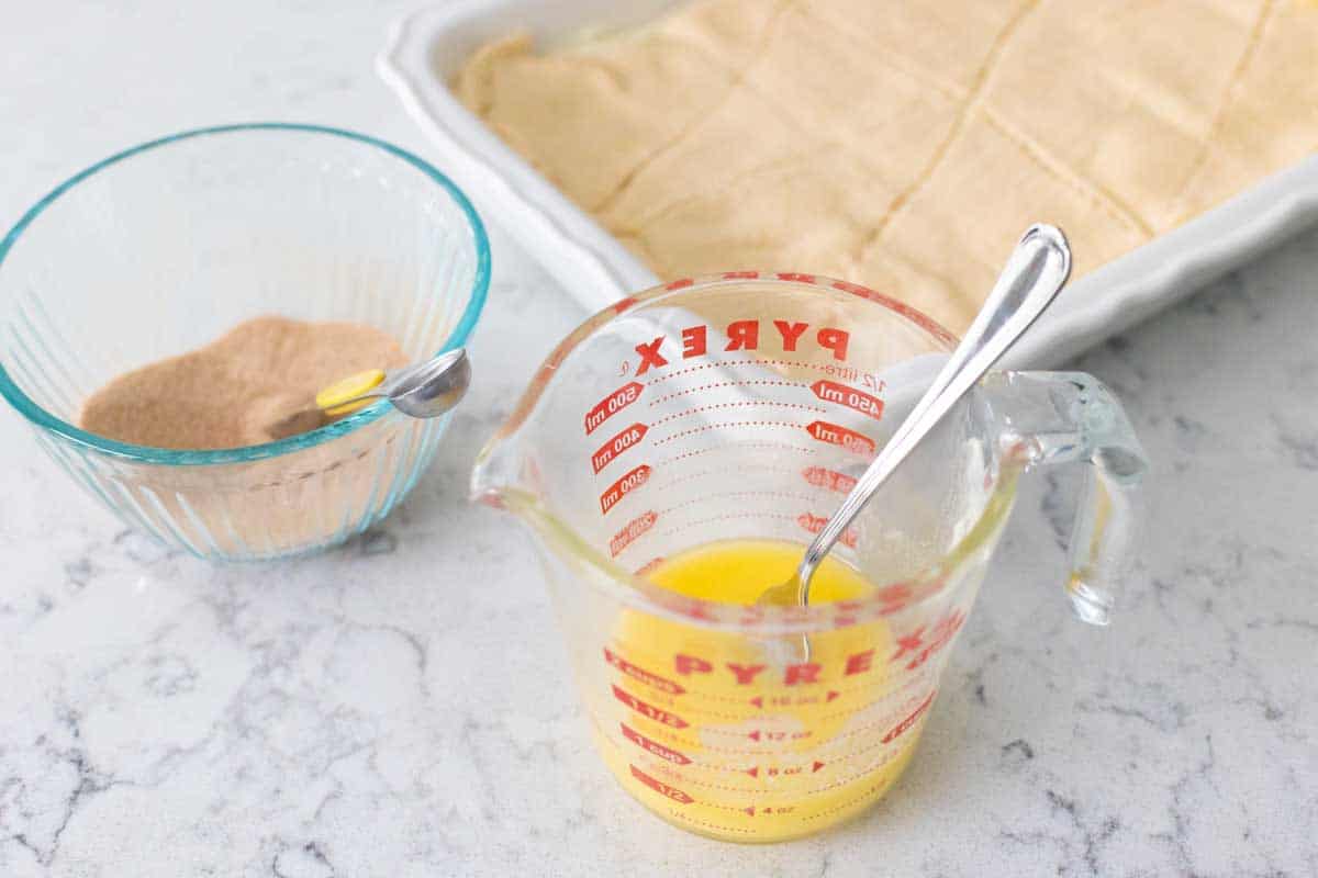 The toppings for the cheesecake are sitting next to the baking pan.