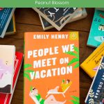 A copy of People We Meet on Vacation by Emily Henry sits on a table.