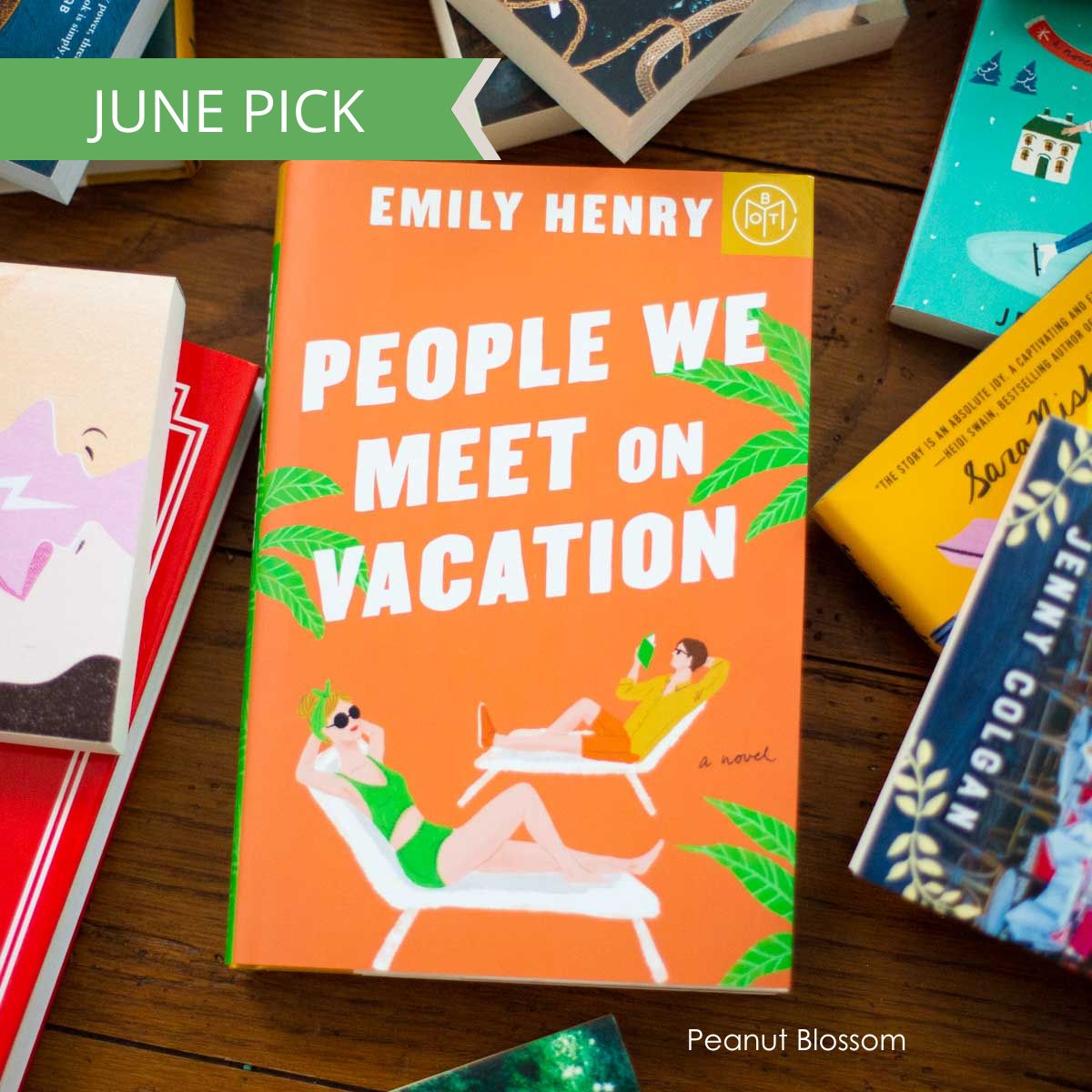 A copy of the book People We Meet on Vacation by Emily Henry sits on a table.