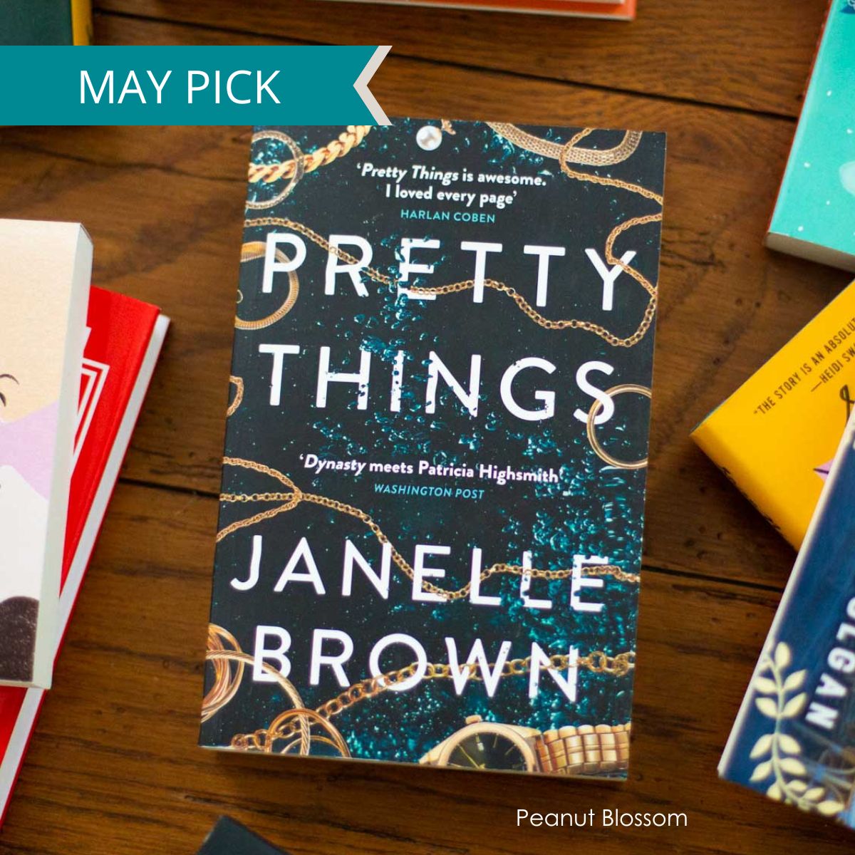 A copy of Pretty Things by Janelle Brown sits on the table.