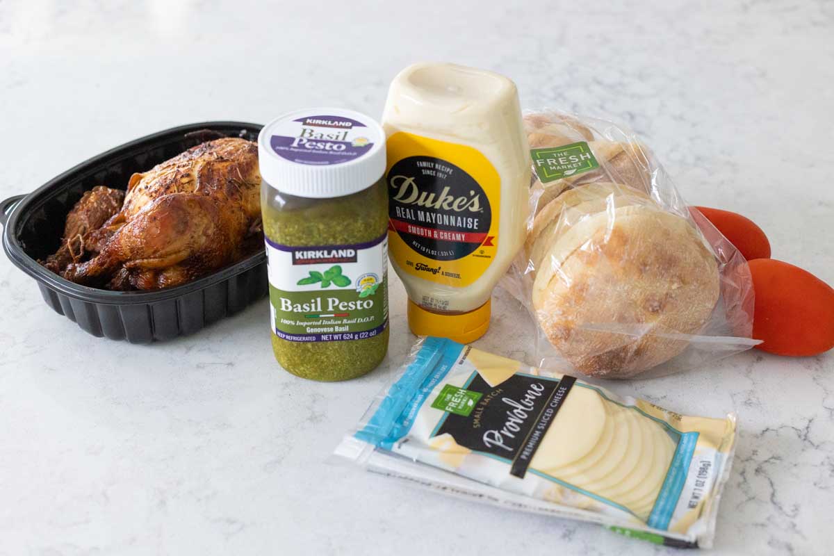 The ingredients to make the chicken sandwiches are on the counter.