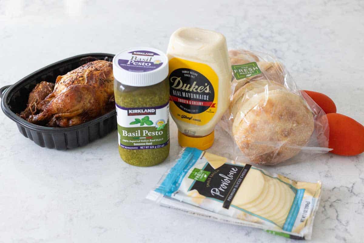 The ingredients to make the chicken sandwiches are on the counter.