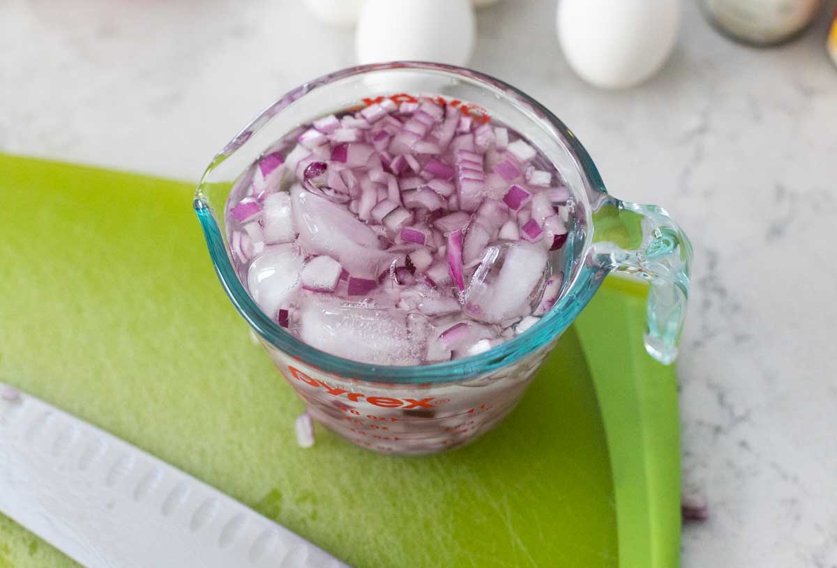 The red onions have been diced and are soaking in ice water.