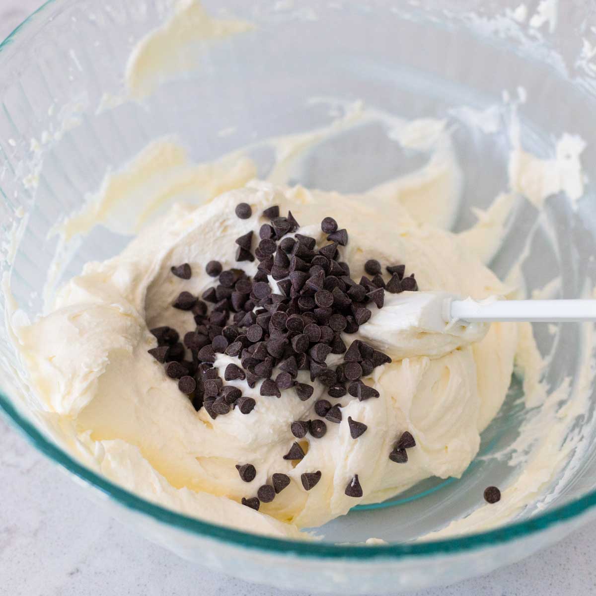 The mini chocolate chips have been added to the mixing bowl.