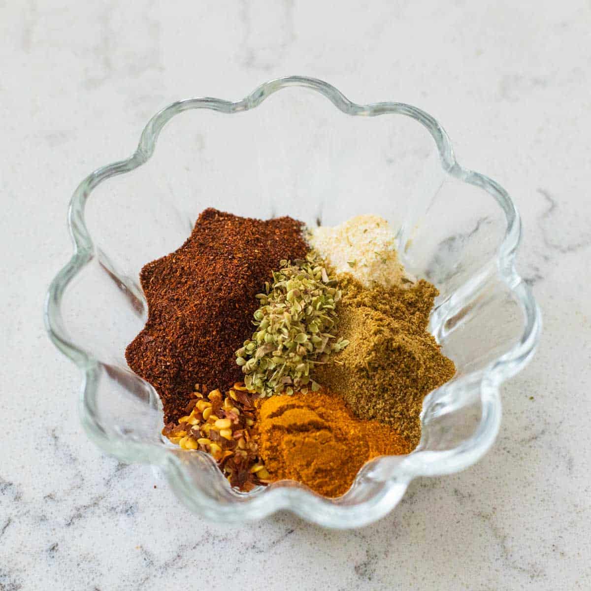 The small glass bowl has all the spices for the pork roast.