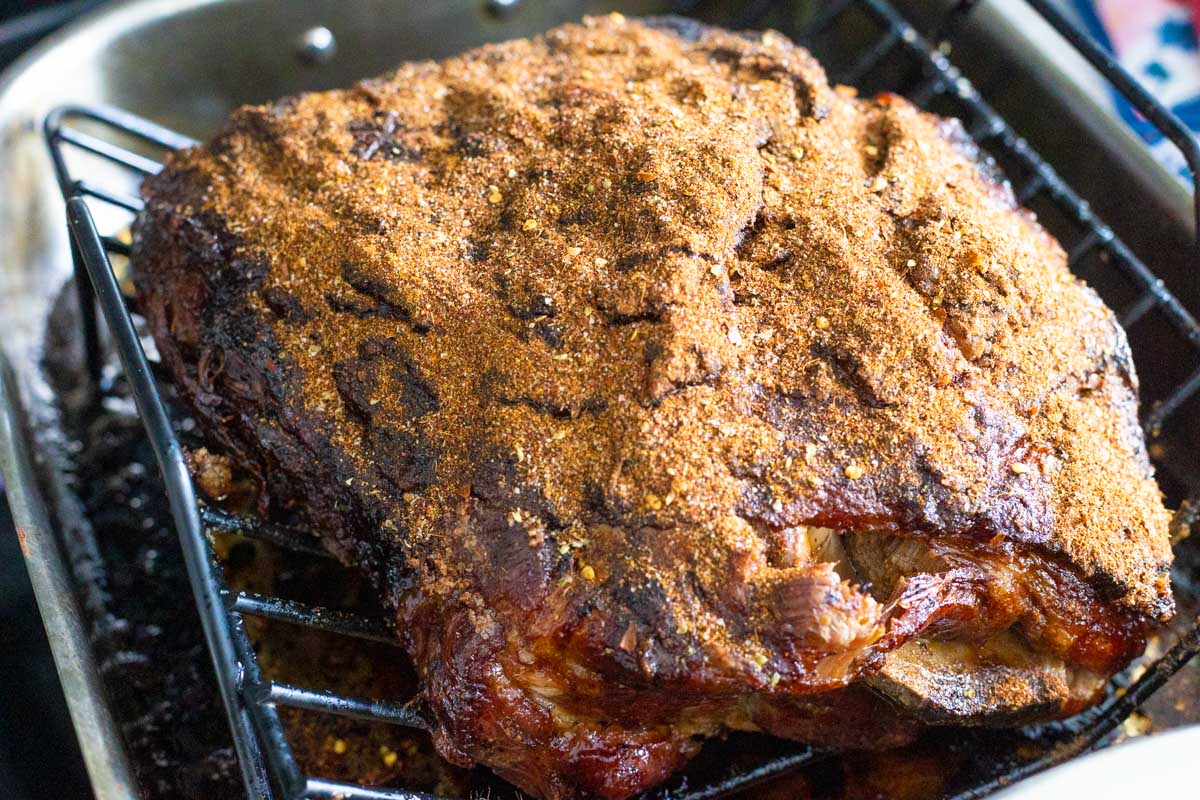 The pork shoulder has had the spice blend sprinkled over the top.