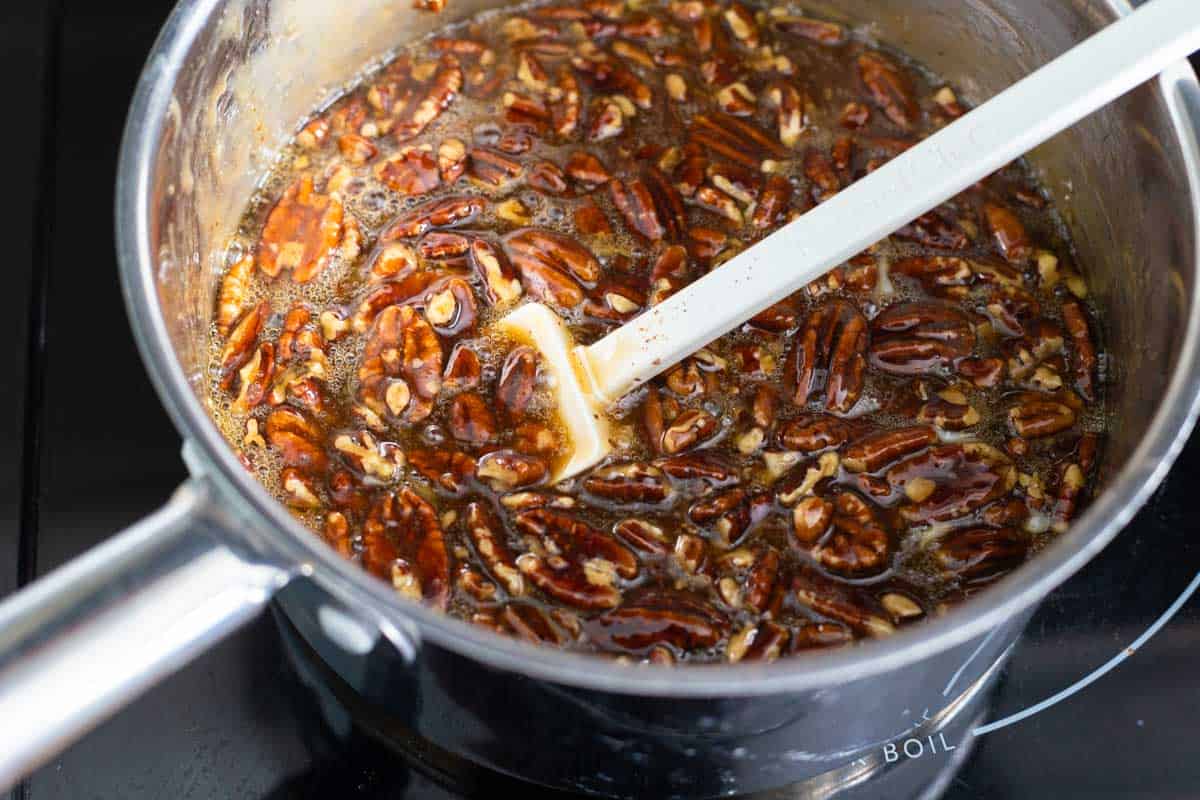 The eggs have been whisked into the pecan pie filling.