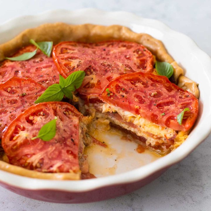 A southern style tomato pie in a deep pie dish.