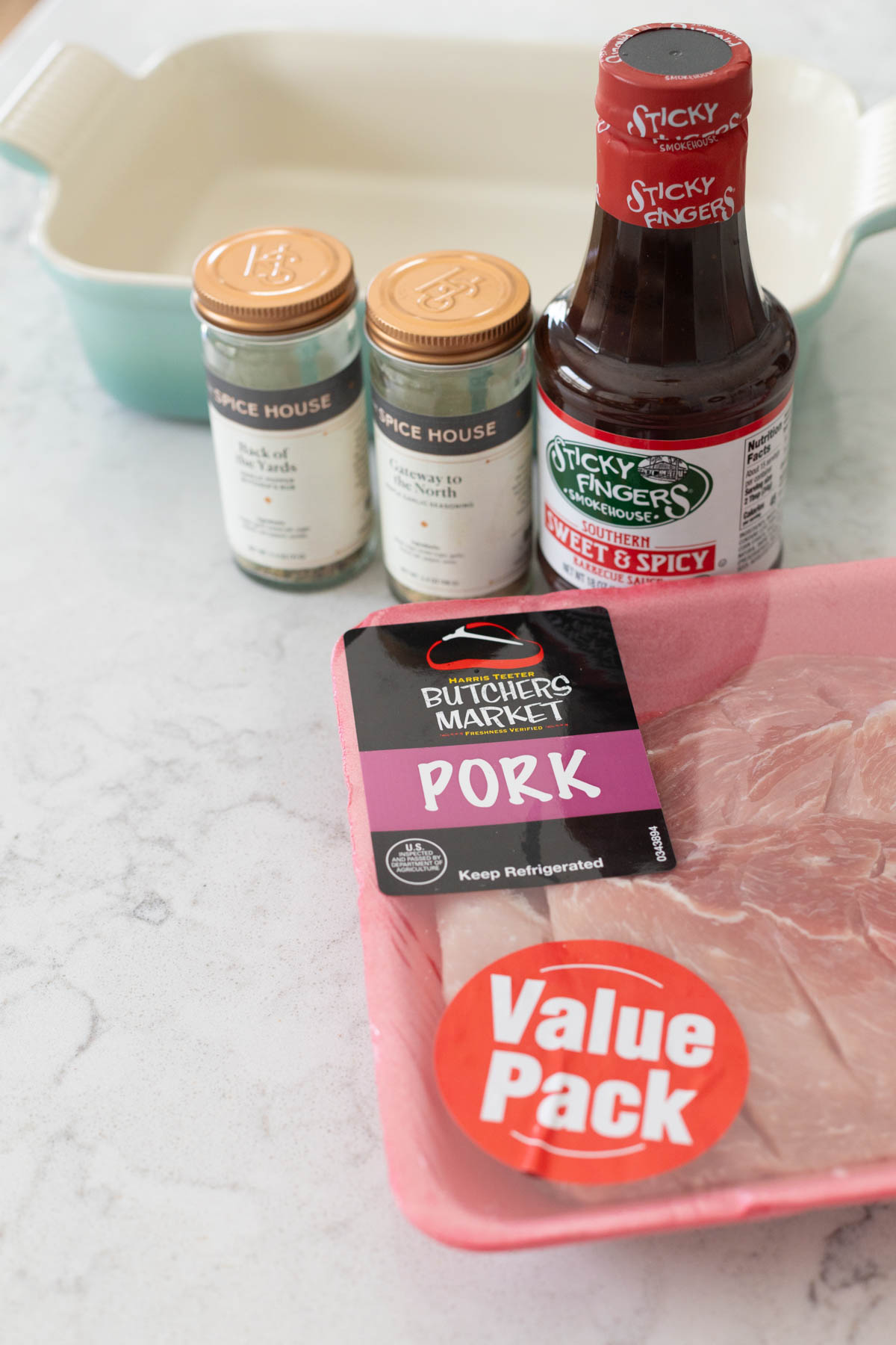 The ingredients to bake boneless pork ribs are on the counter.